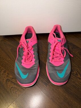 Nike Gray Running Sneakers with Pink Accents and Teal Swoosh